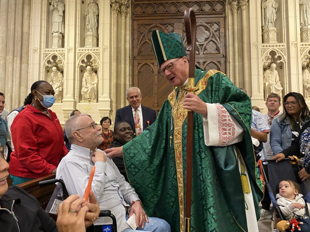 Cardinal Timothy Dolan (in green vestments) greets participants in the Grandparents and Elderly Mass at St. Patrick's Cathedral, September 8, 2024.