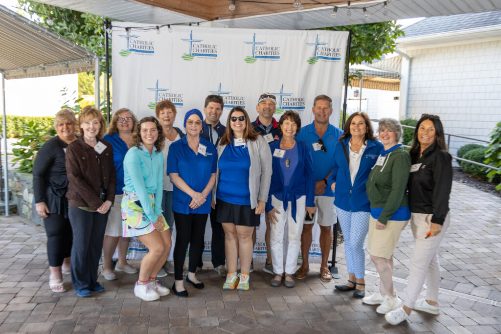 Volunteers and staff welcome golfers to the 18th Catholic Charities Golf for Charity Outing hosted at West Hills Country Club, September 16, 2024.