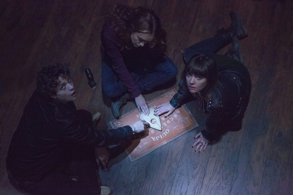 Douglas Smith, Olivia Cooke and Ana Coto star in a scene from the 2014 movie "Ouija."