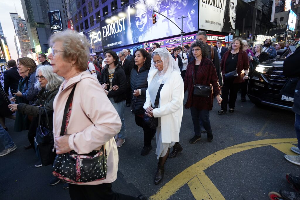 Worshippers participate in a Eucharistic procession through Midtown Manhattan in New York City October 10, 2023.