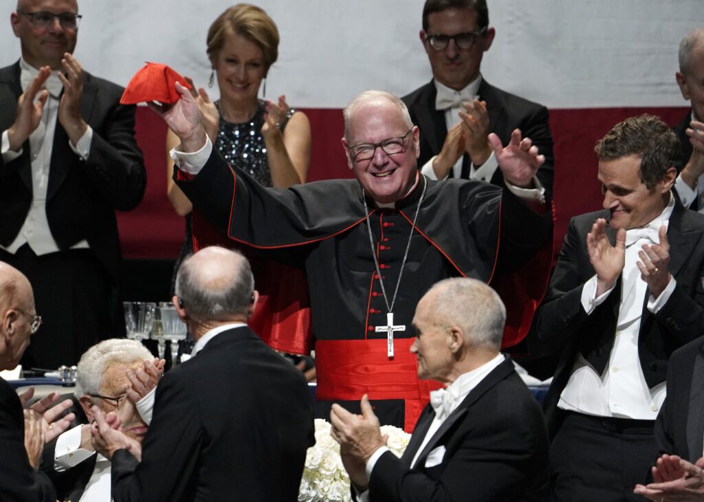 New York Cardinal Timothy M. Dolan waves to the audience after being introduced at the 78th annual Alfred E. Smith Memorial Foundation Dinner at the Park Avenue Armory in New York City Oct. 19, 2023. (OSV News photo/Gregory A. Shemitz)