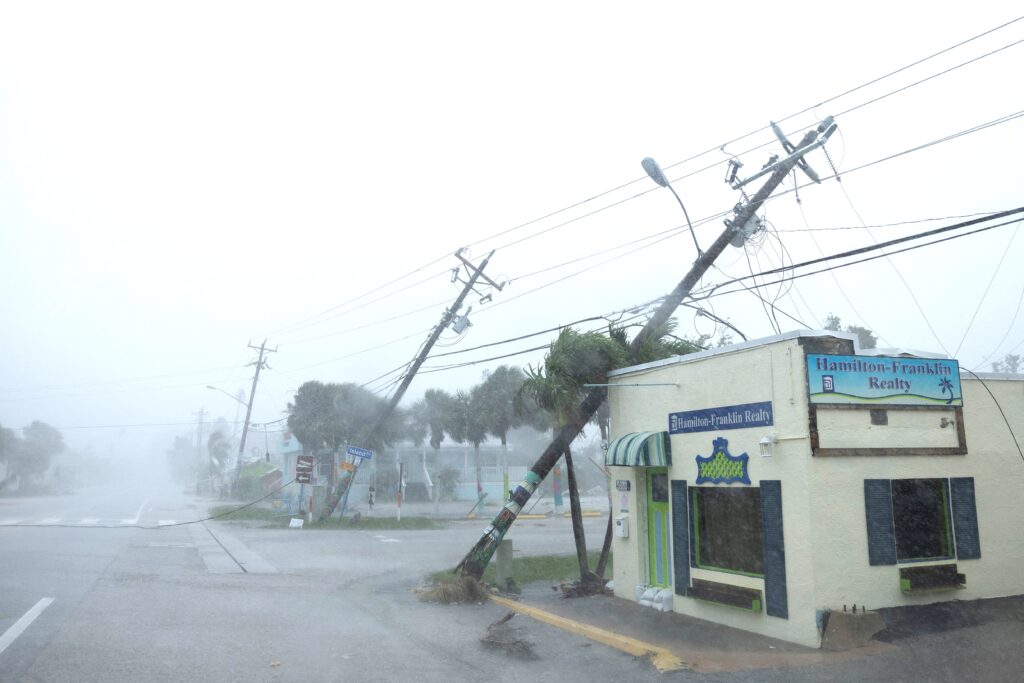 Broken utility poles downed by strong wind gusts are seen as Hurricane Milton approaches Fort Myers, Florida, October 9, 2024.