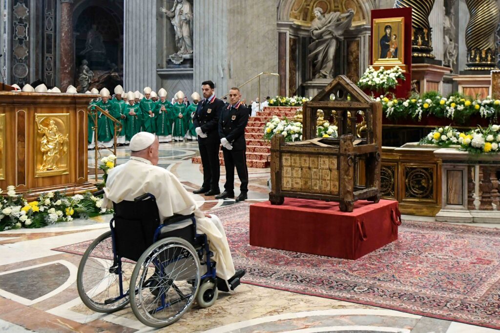 Pope Francis prays before the Chair of St. Peter, placed in front of the main altar of St. Peter’s Basilica, after the closing Mass of the Synod of Bishops on synodality at the Vatican October 27, 2024.