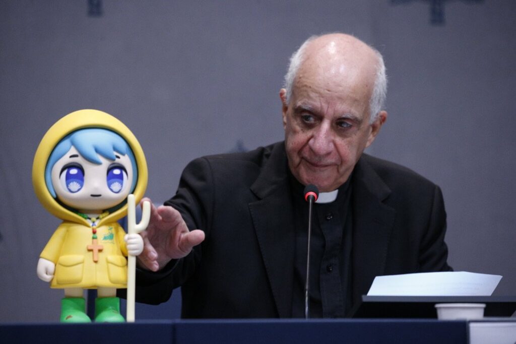 Archbishop Rino Fisichella, pro-prefect of the Dicastery for Evangelization's section for new evangelization and the chief organizer of the Holy Year 2025, presents the official mascot of the Jubilee Year during a news conference at the Vatican on October 28, 2024.