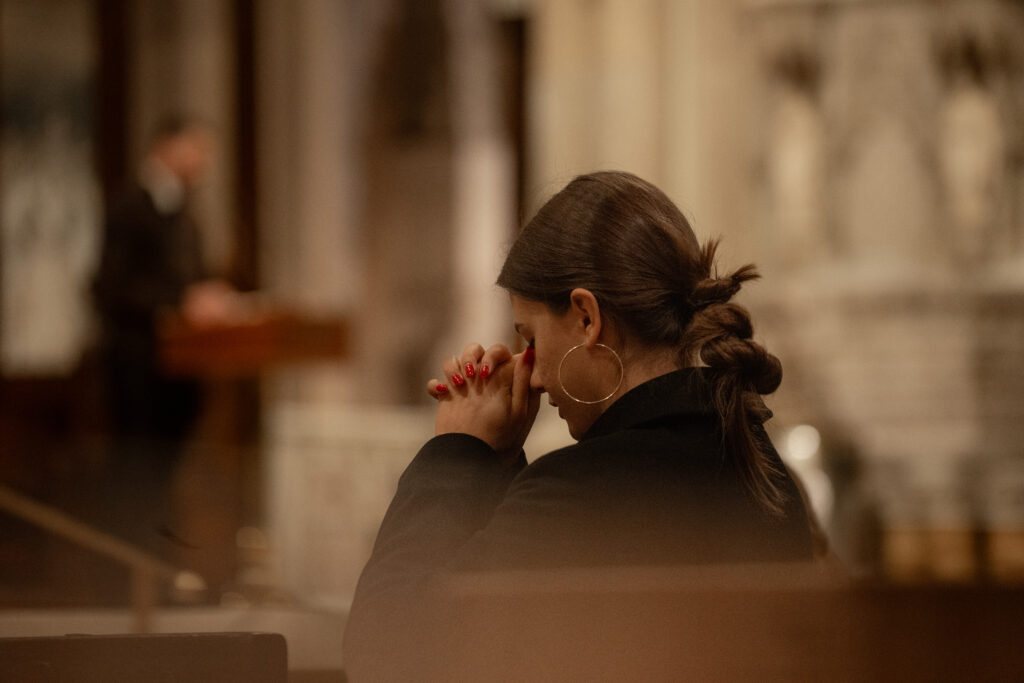 A young parishioner prays during the September 2024 Young Adult Mass at St. Patrick's Cathedral. The November event is scheduled for November 6, 2024.