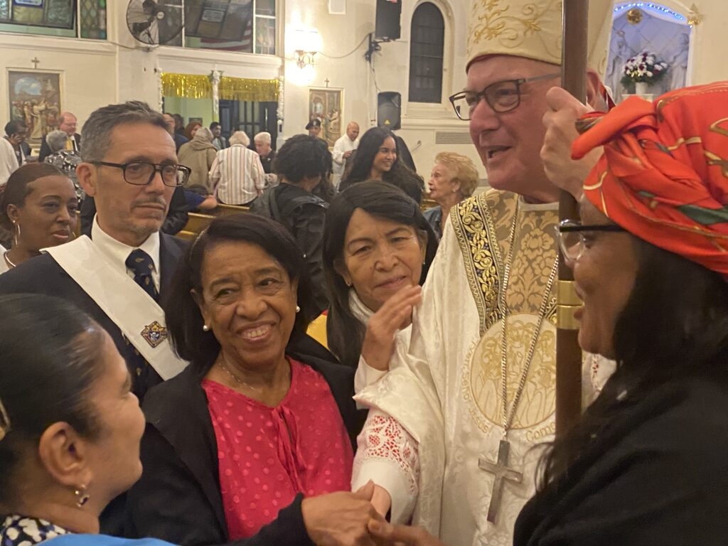 Cardinal Timothy Dolan (right) greets parishioners of St. Angela Merici Church in the Bronx, following that parish's 125th anniversary Mass on September 28, 2024.