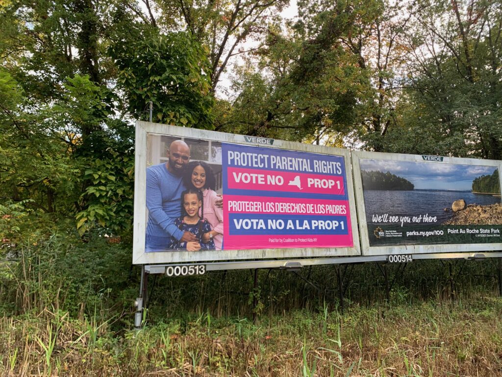 A bilingual billboard encouraging voters to oppose Proposal 1 stands along Route 9W southbound in Ulster Park.