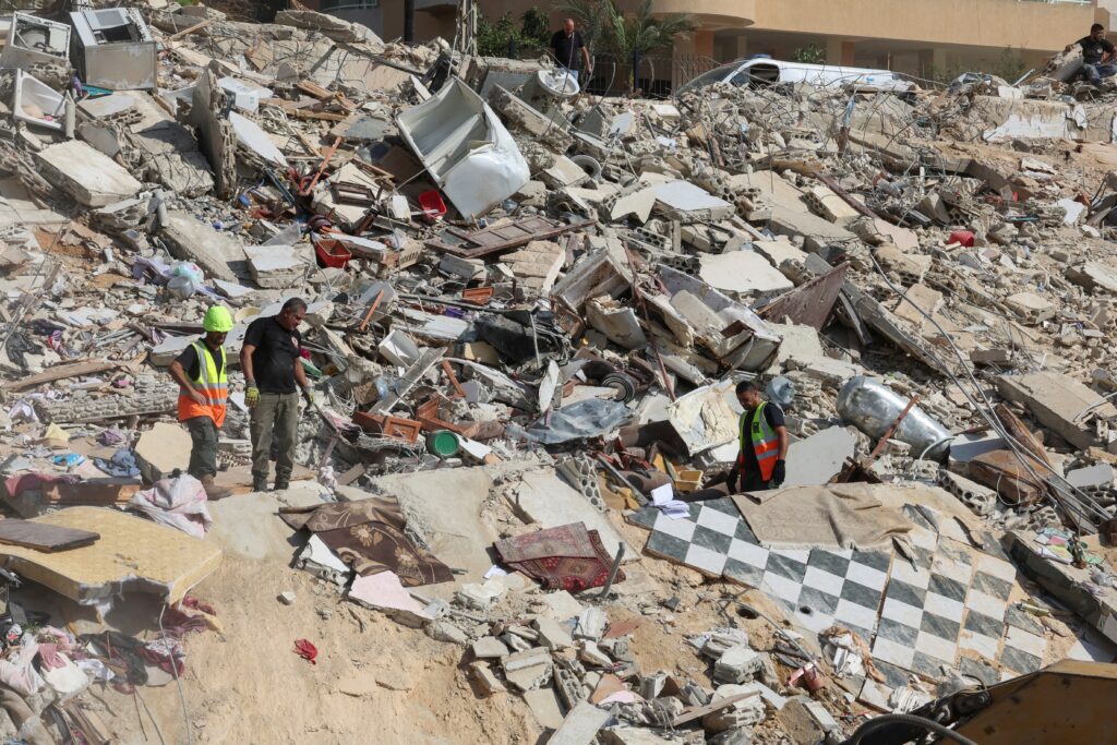 Emergency personnel work September 30, 2024, at the site of an Israeli attack on the Lebanese city of Ain Deleb amid the ongoing hostilities between Hezbollah and Israeli forces.