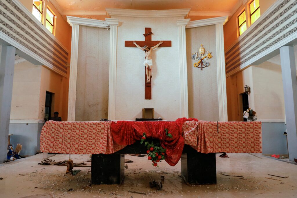 The altar at St. Francis Xavier Church in Owo, Nigeria, is seen June 5, 2022, after gunmen attacked worshippers. In August, Nigerian officials identified six suspects arrested in connection with the attack that killed 40 people.