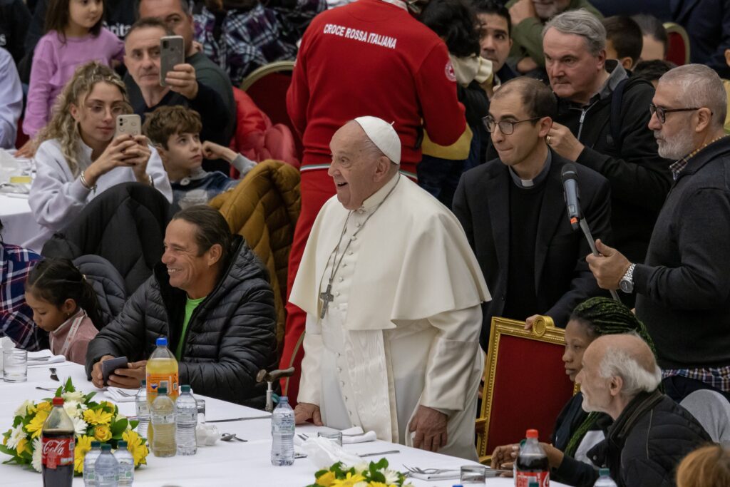 Pope Francis prepares to eat lunch with his guests in the Vatican audience hall November 17, 2024, the World Day of the Poor.