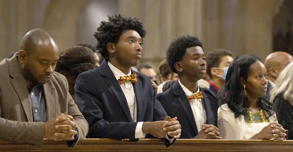 A family is pictured in a file photo praying during Mass at St. Patrick's Cathedral in New York City.