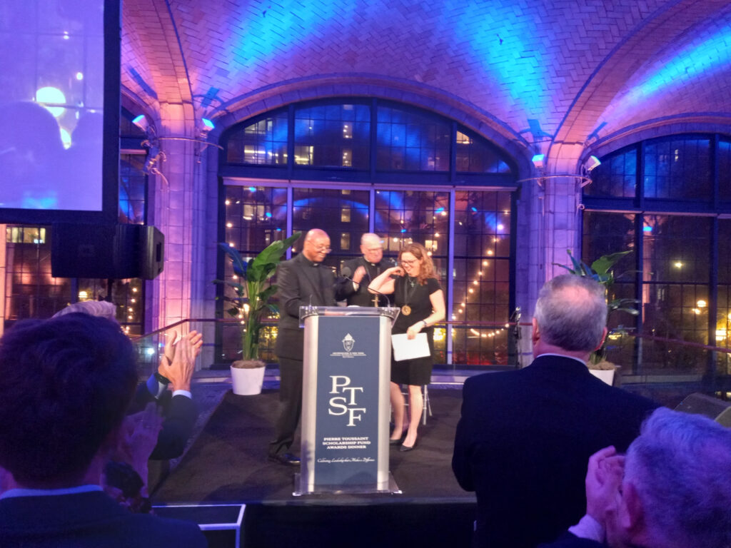 Tania Tetlow, president of Fordham University (right), Cardinal Timothy Dolan (center), and Brother Tyrone Davis, CFC (left), appear during the annual Pierre Toussaint Scholarship Fund Awards Dinner at Guastavino's in Manhattan, Monday, November 4, 2024.