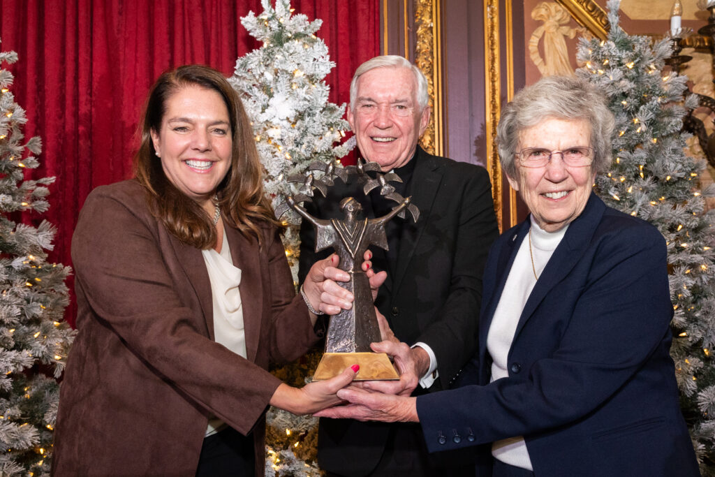 Kerry Alys Robinson (left), president and CEO of Catholic Charities USA, accepts the 2024 Spirit of Francis Award from Catholic Extension Society President Father Jack Ward (center) and Sister Carol Keehan, D.C., at Catholic Extension Society's 10th annual New York City Spirit of Francis Award dinner on December 3, 2024.