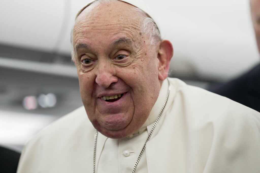 Pope Francis thanks journalists for their work while aboard his return flight to Rome from Ajaccio, France, following his day trip to the island of Corsica on December 15, 2024.