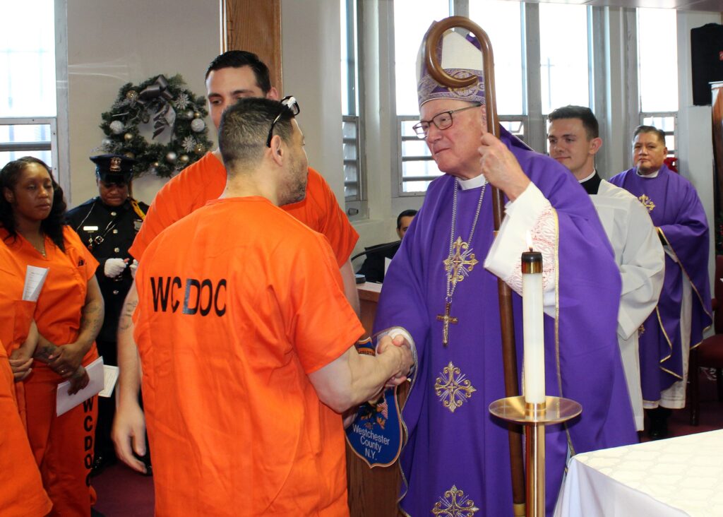 New York Cardinal Timothy M. Dolan greets inmates during a pastoral visit to the Westchester County jail in Valhalla, December 19, 2024.