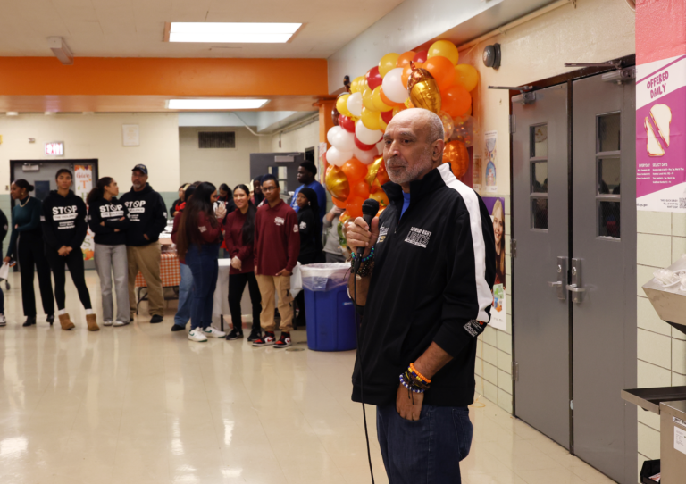 Pedro Mejia, Director of La Plaza Beacon School Program, addresses the crowd to show his thanks for the support of the community.