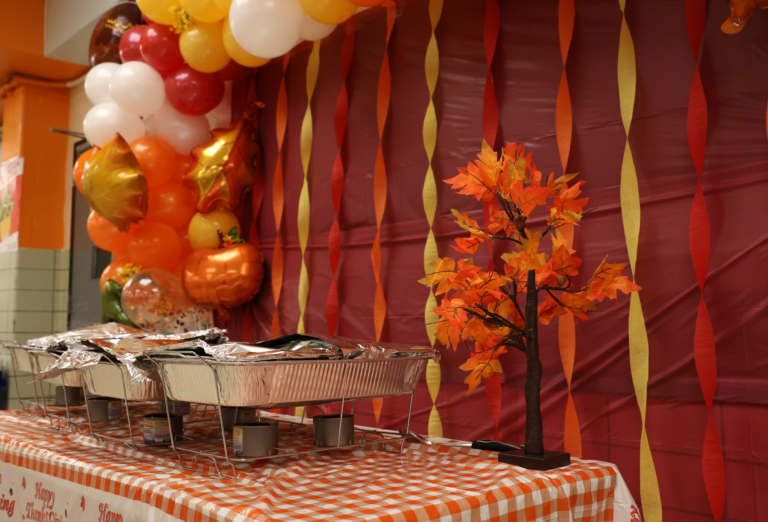 A fall-themed layout sets a festive mood as trays of turkey are served.