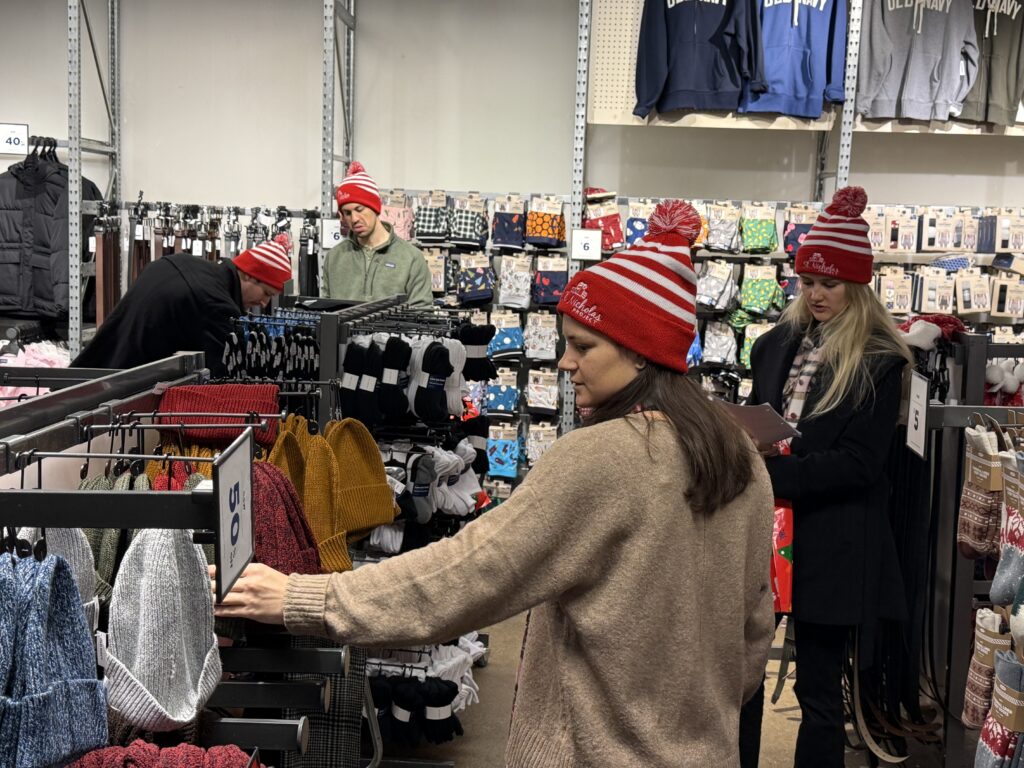 Volunteer shoppers search for needed winter clothing items during Catholic Charities’ annual St. Nicholas Project Shopping Day, December 7, 2024.