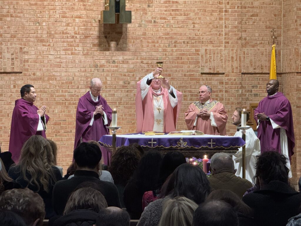 Cardinal Timothy Dolan (center) celebrated Mass with Auxiliary Bishop Peter Byrne (second left) and the priests of Holy Rosary Church of South Beach, Staten Island, on December 14, 2024. Photo by Steven Schwankert/The Good Newsroom.