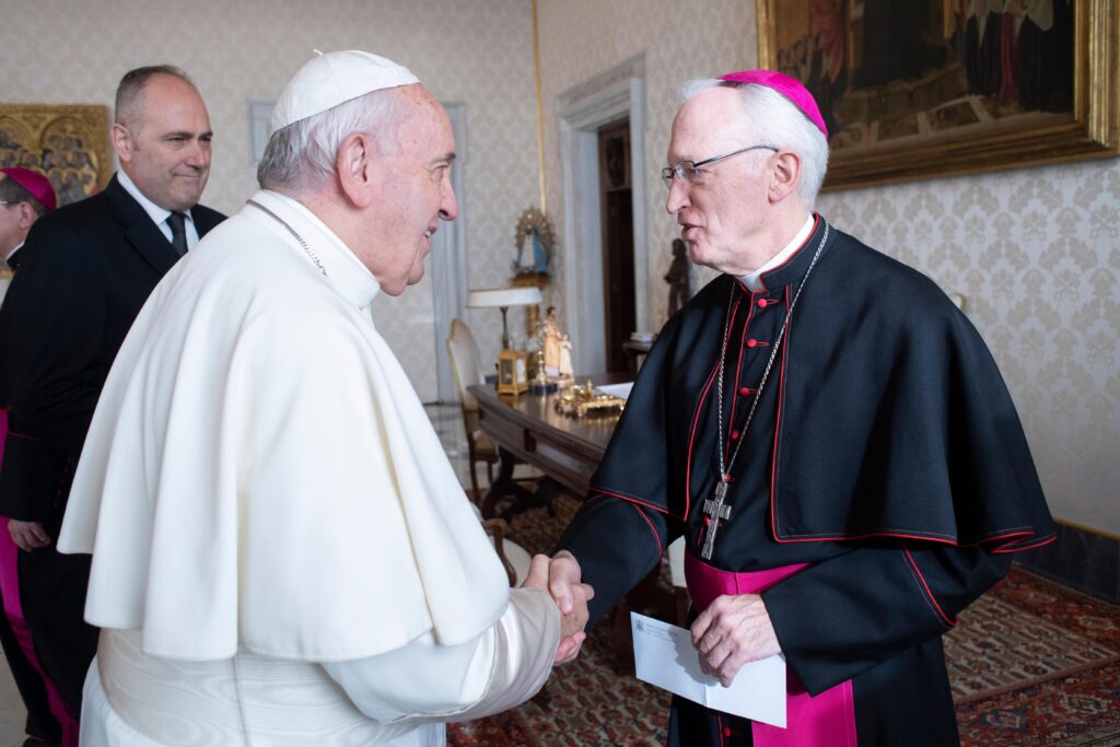 Pope Francis (left) greets Bishop Earl A. Boyea Jr. of Lansing, Michigan, during a meeting with U.S. bishops from Ohio and Michigan making their "ad limina" visits to the Vatican December 10, 2019.