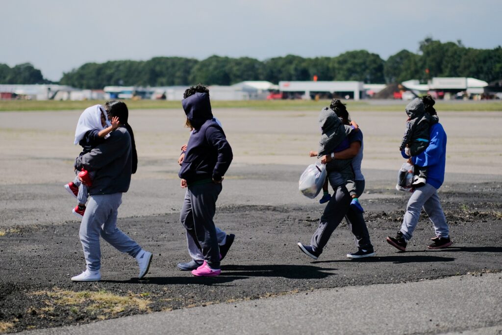 Guatemalan migrants with children walk after arriving at La Aurora Air Force Base on a deportation flight from the U.S., in Guatemala City November 8, 2024. (OSV News photo/Josue Decavele, Reuters)