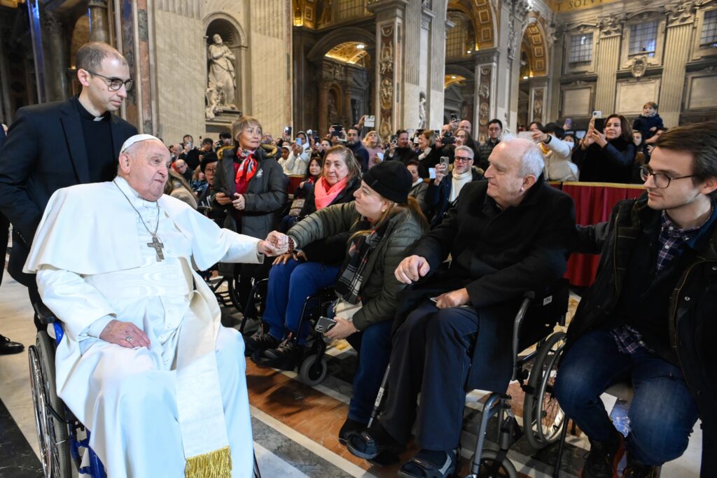 Pope Francis greets people at the conclusion of Mass in St. Peter's Basilica at the Vatican January 1, 2025, the feast of Mary, Mother of God, and World Peace Day.