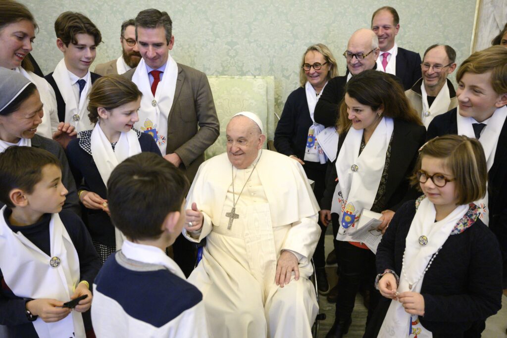 Pope Francis greets members of the "Écoles de Vie" ("Schools of Life"), a French association that organizes educational solidarity projects, during a meeting at the Vatican January 10, 2025.