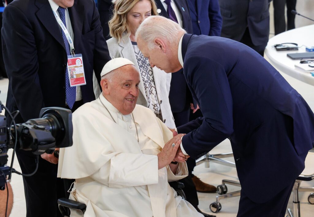 Pope Francis greets U.S. President Joe Biden June 14, 2024, before the pontiff gave a speech to world leaders at the Group of Seven summit in Borgo Egnazia in Italy's southern Puglia region.