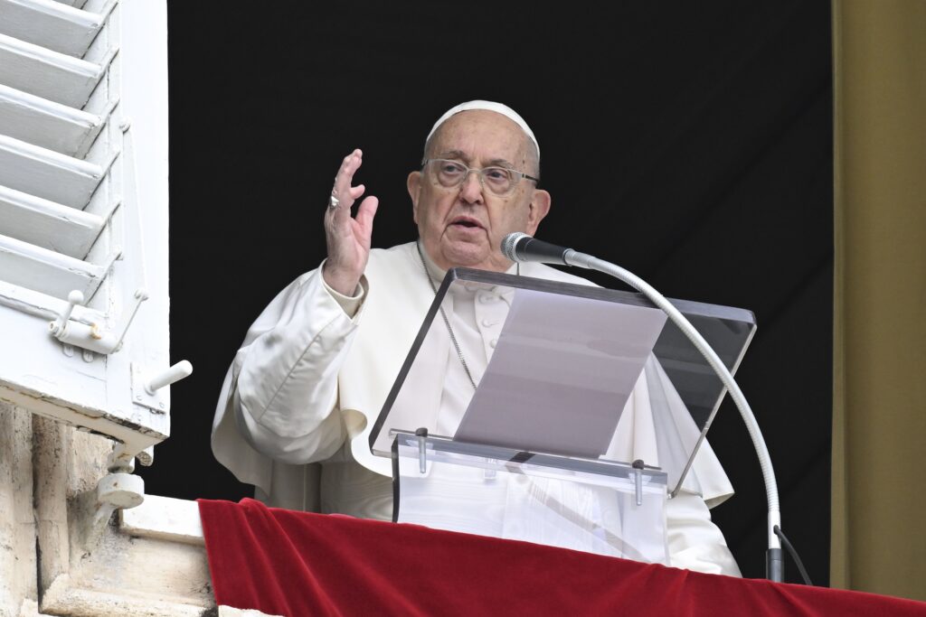 Pope Francis gives his blessing to people gathered in St. Peter's Square at the Vatican for the recitation of the Angelus prayer January 12, 2025.