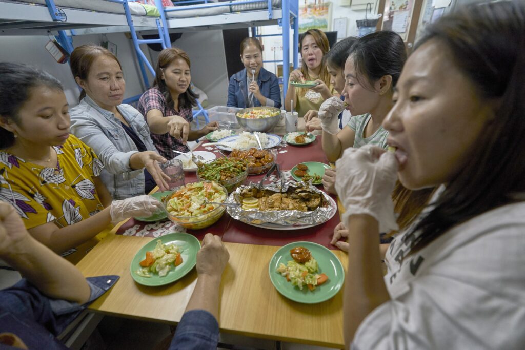 Women share a meal November 9, 2024, in a shelter run by Bethune House in Hong Kong.