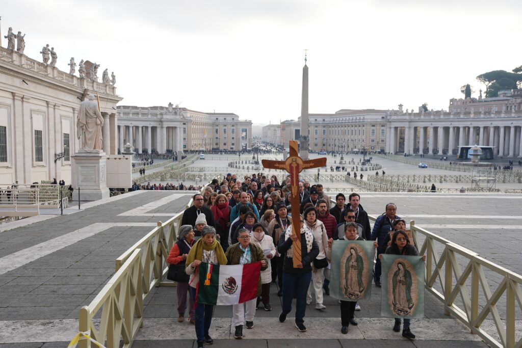 Pilgrims make their way through St. Peter's Square toward the Holy Door of St. Peter's Basilica during the Jubilee of the World of Communications at the Vatican on January 25, 2025.