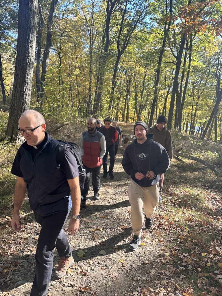 Father George Sears (left) leads young men on a hike as part of discernment programs available through St. Joseph's Seminary in Yonkers.