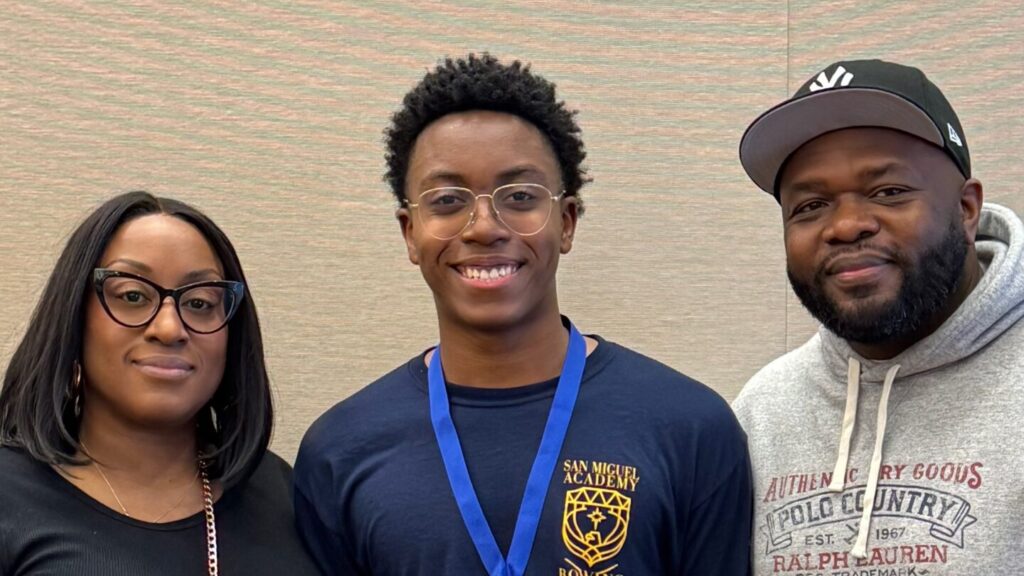 Jermain with his mother and Arshay Cooper after his first-place finish. Photo courtesy of San Miguel Academy.