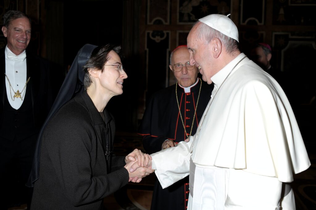 Pope Francis greets Sister Raffaella Petrini, an Italian member of the U.S.-based Franciscan Sisters of the Eucharist who is secretary-general of the office governing Vatican City State, at the Vatican December 3, 2015.