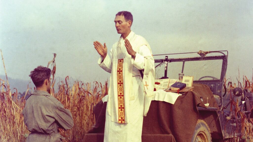 Father Emil Joseph Kapaun, a U.S. Army chaplain, is pictured celebrating Mass from the hood of a jeep October 7, 1950, in South Korea. A candidate for sainthood, he died May 23, 1951, in a North Korean prisoner of war camp. (OSV News photo/courtesy U.S. Army medic Raymond Skeehan)