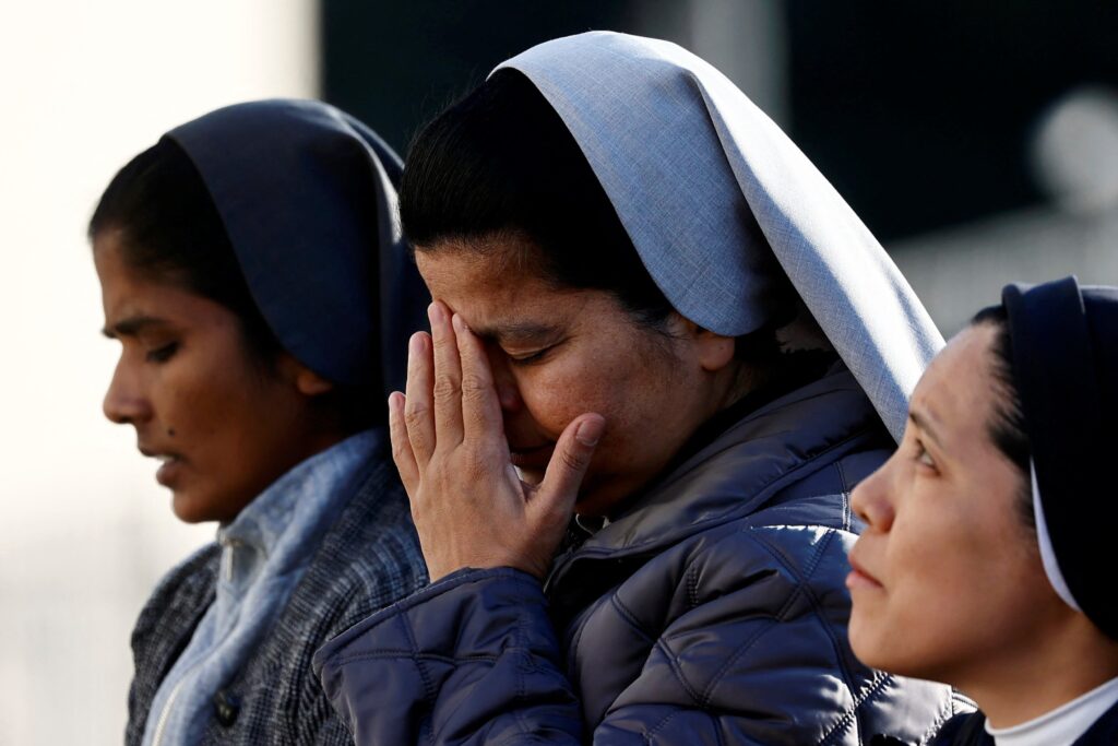 Nuns pray in front of Rome’s Gemelli Hospital February 22, 2025, where Pope Francis is admitted for treatment.