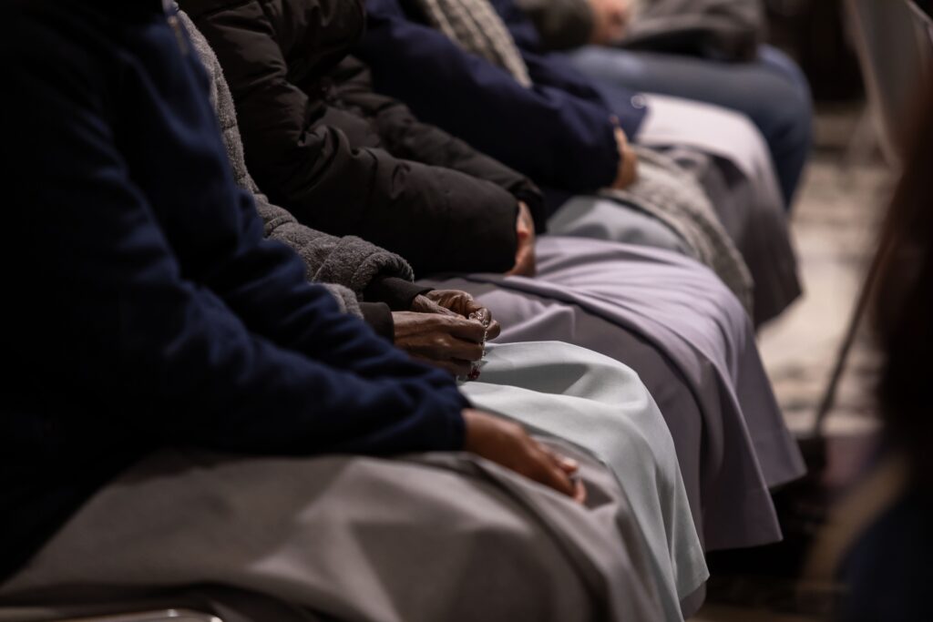 People pray for the ailing Pope Francis during a special evening Mass February 23, 2025, in Rome's Basilica of St. John Lateran. (CNS photo/Pablo Esparza)