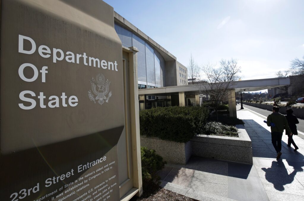 People are pictured in a file photo entering the U.S. Department of State building in Washington. The State Department has terminated its contract with the U.S. Conference of Catholic Bishops to legally resettle refugees, following a suspension of the arrangement in January 2025. OSV News photo/Joshua Roberts, Reuters)