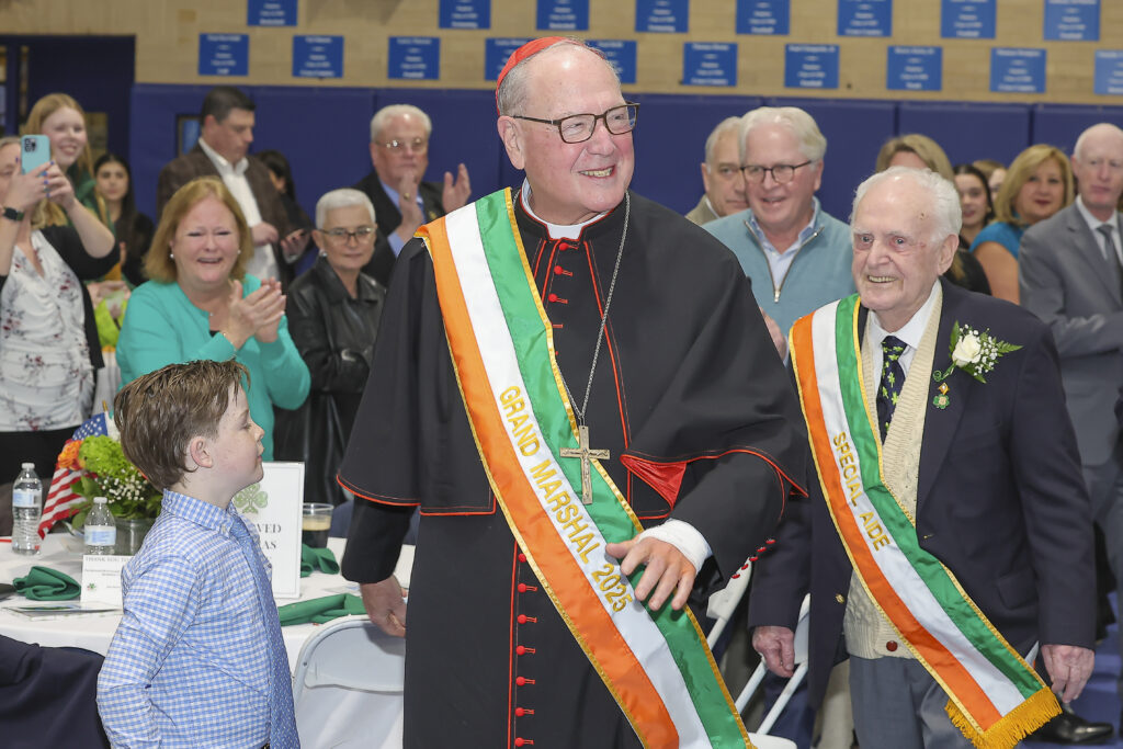 Cardinal Dolan marches in to the February 27 installation with Special Aide, Davide Walsh, age 93, who was born in Ballina, Ireland. The 26th Annual St. Patrick’s Day Parade in White Plains will take place on Saturday, March 8, 2025. Photo courtesy of the White Plains St. Patrick’s Day Parade Committee.