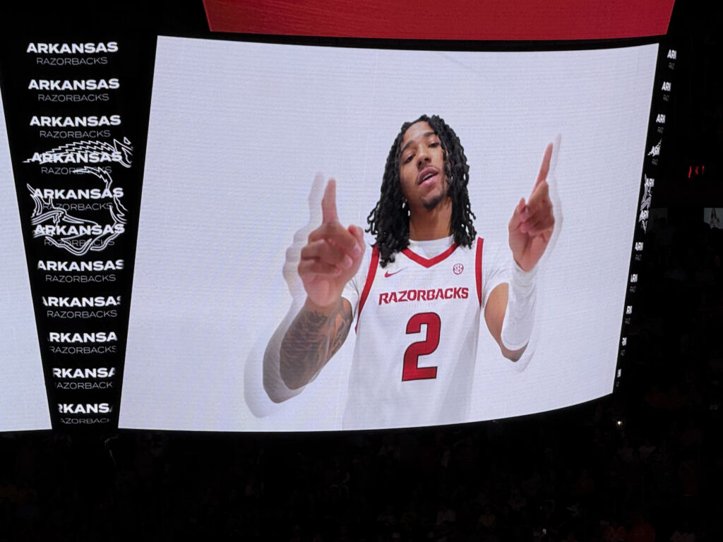 University of Arkansas guard Johnuel “Boogie” Fland appears on the Madison Square Garden display screen prior to his team’s game against the University of Michigan on December 10, 2025.