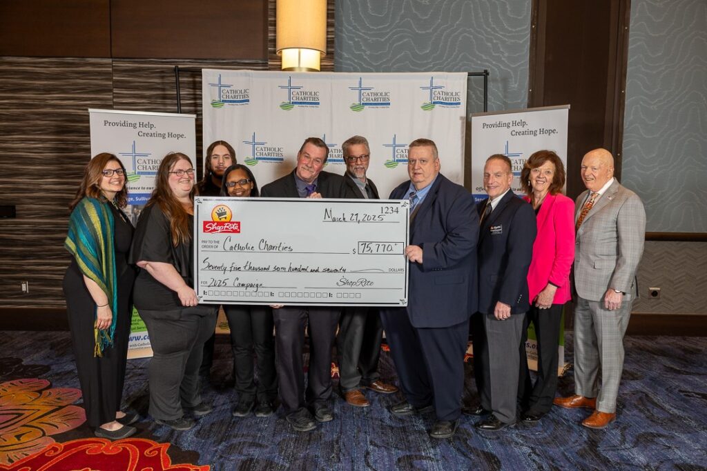At Catholic Charities of Orange, Sullivan, and Ulster’s annual Celebration of Charity dinner, ShopRite Supermarket store representatives presented Catholic Charities’ CEO Shannon Kelly (far left) and Board Chair Thomas Strahle (far right) with the ceremonial check for $75,770 from the 2025 in-store Feeding Our Neighbors campaign. Photo credit: Everett Collie, EC Media Group
