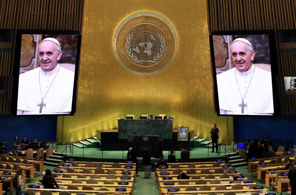 Images of the late Pope Francis are displayed on screens in the General Assembly ahead of a session paying tribute to his death at UN headquarters in New York on April 29, 2025.