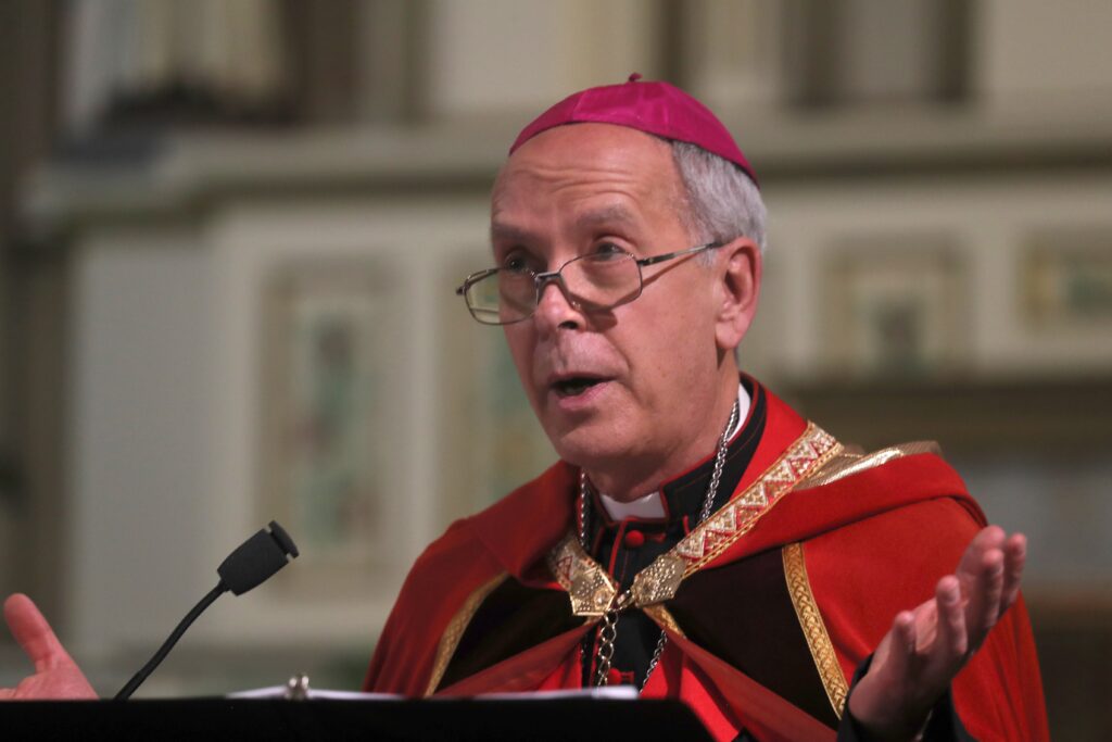 Bishop Mark J. Seitz of El Paso, Texas, leads a prayer vigil at Sacred Heart Church in El Paso March 24, 2025, following a rally and march against mass deportations by the US government.