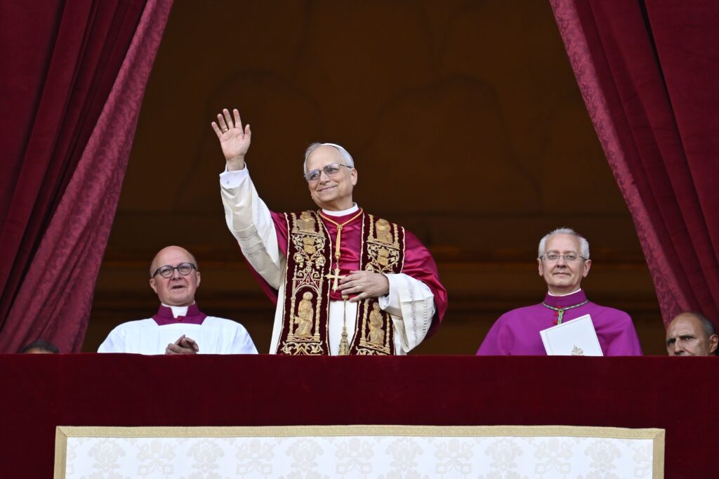Pope Leo XIV, the former Cardinal Robert F. Prevost, waves to the crowds in St. Peter's Square at the Vatican after his election as pope May 8, 2025. The new pope was born in Chicago. (CNS photo/Vatican Media)