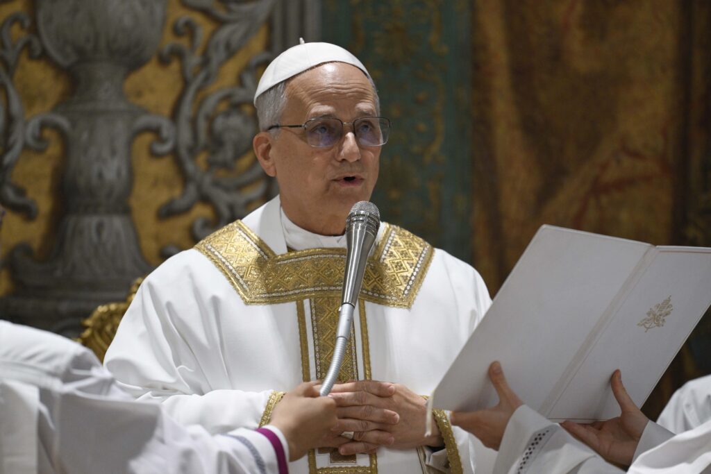 Pope Leo XIV offers a prayer during his first Mass as pope with the cardinals who elected him in the Sistine Chapel at the Vatican May 9, 2025.