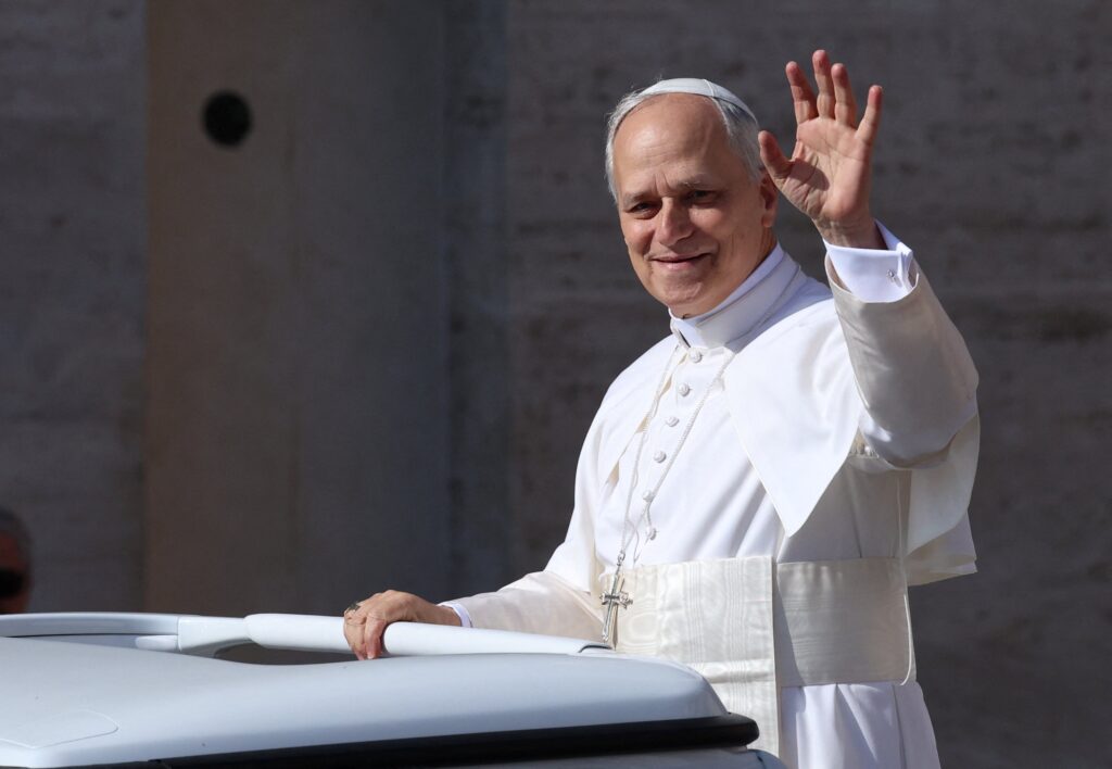 Pope Leo XIV, formerly Cardinal Robert Francis Prevost, waves as he arrives to celebrate his inauguration Mass at the Vatican May 18, 2025.