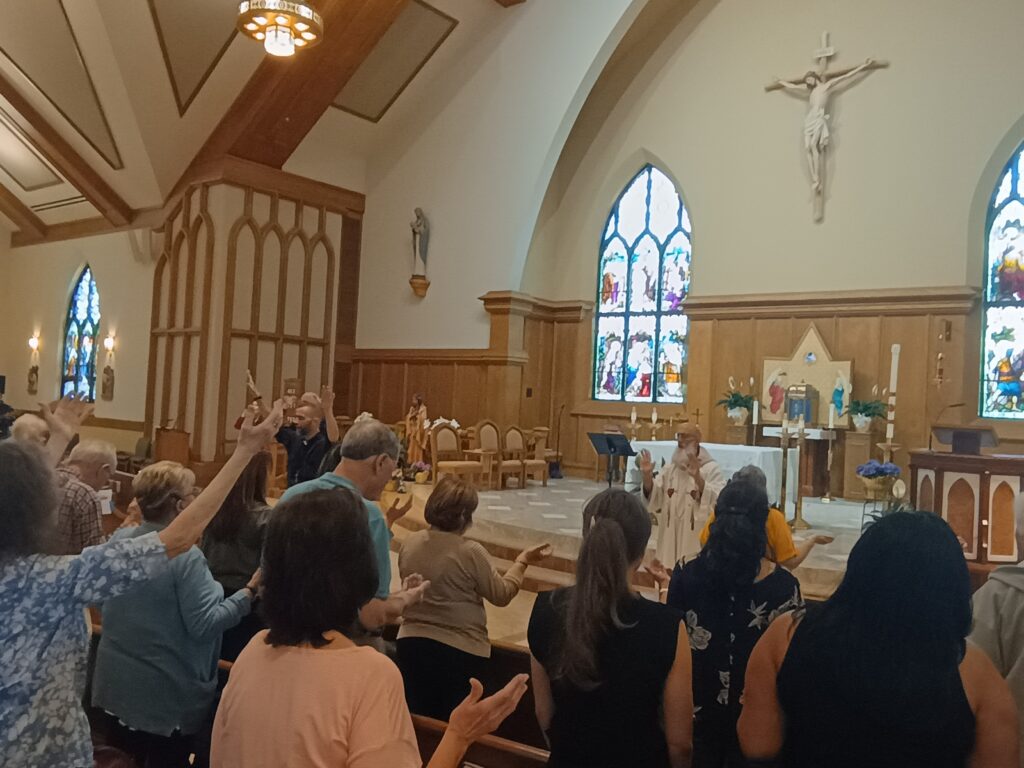 Priests of the archdiocese lead the faith in prayer during the May 17, 2025, Prayer Conference and Healing Service at St. Kateri Tekakwitha Church, Lagrangeville. Photo by: Armando Machado/The Good Newsroom