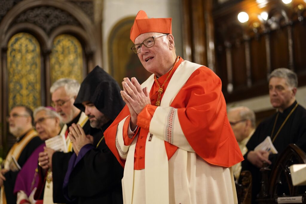 New York Cardinal Timothy M. Dolan joins the assembly in reciting the Nicene Creed during an ecumenical prayer service for peace in the world in honor of Mary, Mother of God, at Our Lady of Lebanon Maronite Cathedral in the Brooklyn Heights section of Brooklyn, N.Y., May 20, 2025. In a May 29 Wall Street Journal commentary, Cardinal Dolan said he is "stunned" that New York lawmakers "are on the verge of legalizing suicide," and he said he prays the governor "will step up to protect precious human life." Photo: OSV News/Gregory A. Shemitz.