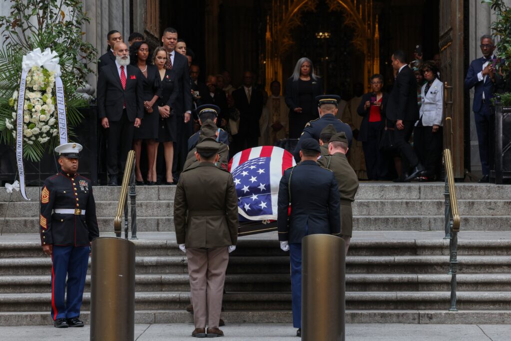 Family members watch as former U.S. Rep. Charles Rangel's casket is carried into St. Patrick's Cathedral in New York City on June 13, 2025.