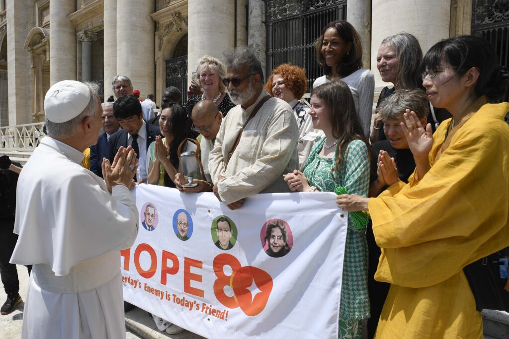 Pope Leo XIV greets a delegation representing "Hope 80" -- a project that brings together the descendants of historical figures such as Mahatma Gandhi, Winston Churchill, Harry Truman, and Hideki Tojo in the name of peace -- in St. Peter's Square after his general audience at the Vatican on June 18, 2025.